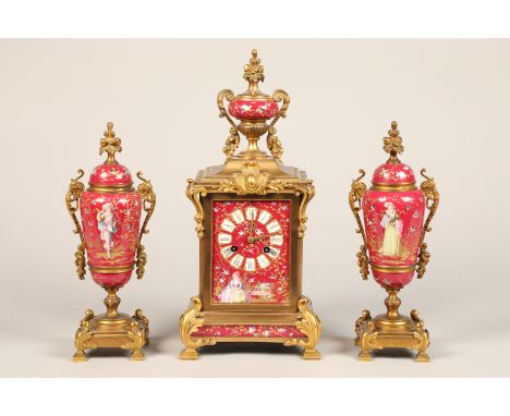 19th Century French three piece ormolu and porcelain clock set, the porcelain panels in pink decorated with hand painted bird