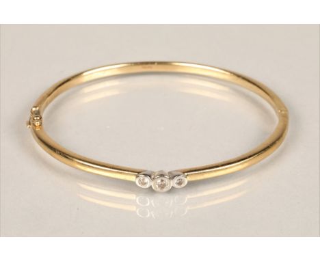 Ladies 9ct yellow gold stiff bangle, set with three small diamonds, diameter 6.5cm, weight 14.3g