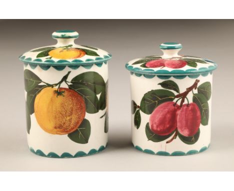 Scottish Wemyss pottery preserve jars and covers, hand painted with plumb's, height 10.5cm and the other with a yellow fruit,