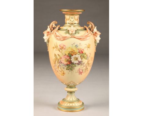 Royal Worcester vase, baluster form, pinched neck with Bacchus mask handles, raised on a circular foot and decorated with han