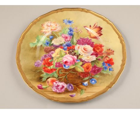 Royal Worcester cabinet plate, decorated with a hand painted floral spray, signed E Barkley, finished with a guilt border, di