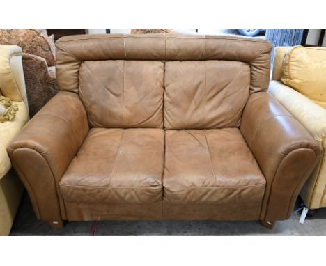 A tan leather two seater sofa, 150 x 100 x 90 cm high 