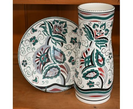 A Poole Pottery vase with Art Deco style floral and foliate painted design signed U Rolfe, 31 cm, to/w a 27 cm plate with sim