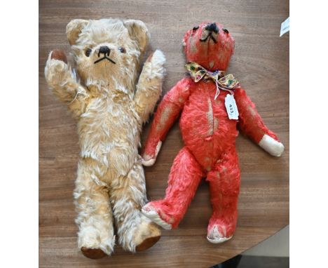 A vintage red-plush teddy-bear with glass eyes, stitched nose and rotating limbs with replacement pads, 35 cm, to/w a Deans R