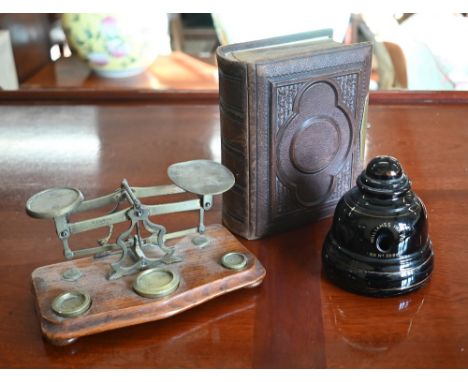 A Victorian embossed leather photograph album with gilt brass lock, containing a quantity of family portraits, to/w a Victori