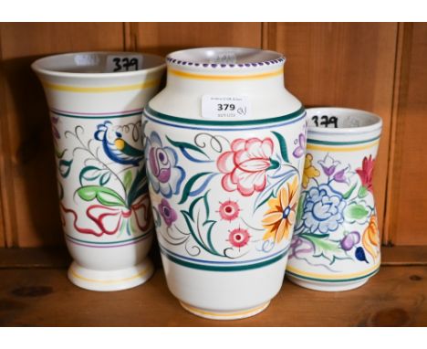 Three floral-painted Poole pottery vases, 22 - 16 cm 