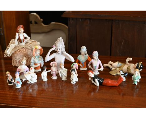 A collection of vintage china pin-cushion figures and reclining female figures, etc 