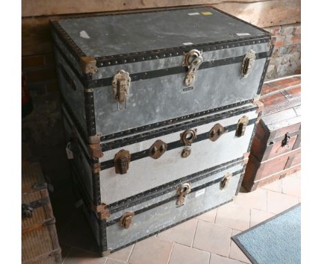 A pair of vintage zinc school type luggage trunks by Mossman, London, 90 cm x 51 cm x 35 cm h to/with another similar trunk (