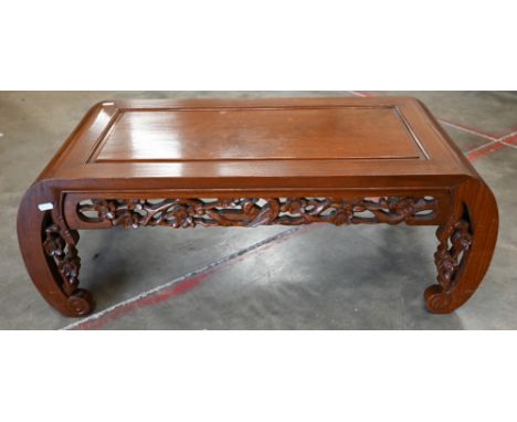 A 20th century Chinese hardwood small coffee table with scroll legs and bird and prunus design carved frieze, 85 cm wide x 40