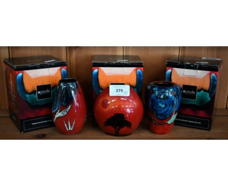 A boxed Poole pottery 'African Sky' 10 cm purse-vase, to/w two other boxed Poole red-ground small vases (3) 