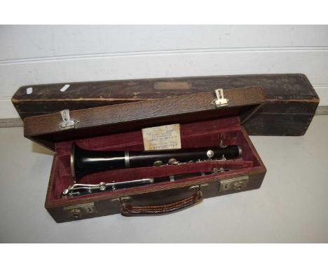 Cased clarinet marked J R Lafleur, London and Paris together with a further carved wooden instrument case