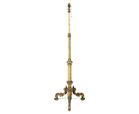 A late Victorian gilt brass standard lamp, with an adjustable spiral fluted stem, on twin-leaf scroll legs, 155cm high (max),