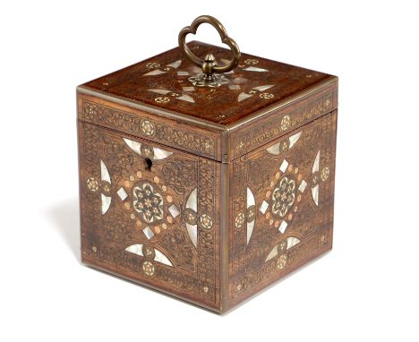 A Moorish walnut cube tea caddy, inlaid with brass, mother of pearl, copper and bone with parquetry designs and scrolling lea