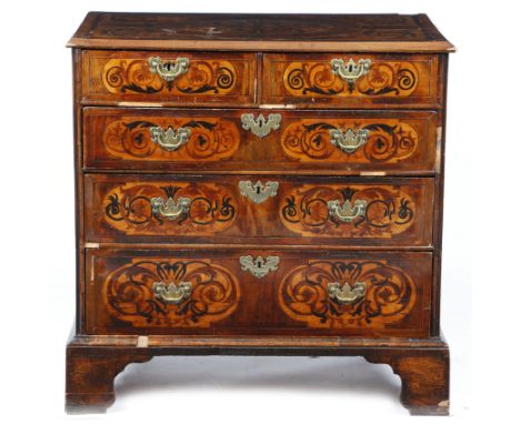 An Anglo-Dutch walnut and fruitwood marquetry chest, inlaid with panels of scrolling leaves and flowers, with two short and t