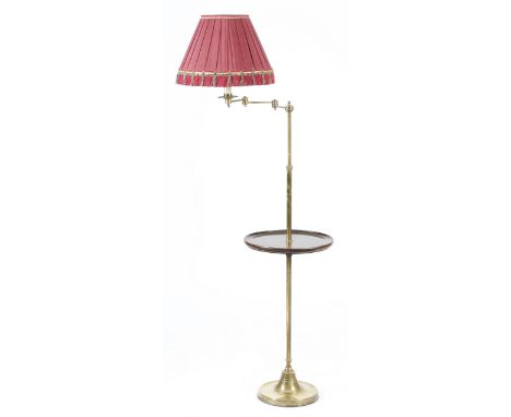 A brass lamp table, with an adjustable arm and stem, above a dished mahogany tier, 167.8cm high (max).