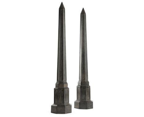 A pair of 19th century ebony architectural models of columns, of octagonal fluted form, 85.3cm high. (2)