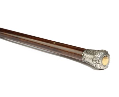 λ A Victorian walking cane, the silver coloured metal handle engraved and repousse decorated with flowers and leaves, the top