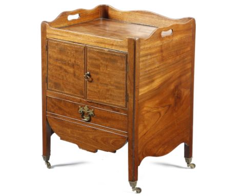 A George III and later mahogany tray-top bedside commode, the serpentine gallery pierced with two handgrips, above a pair of 