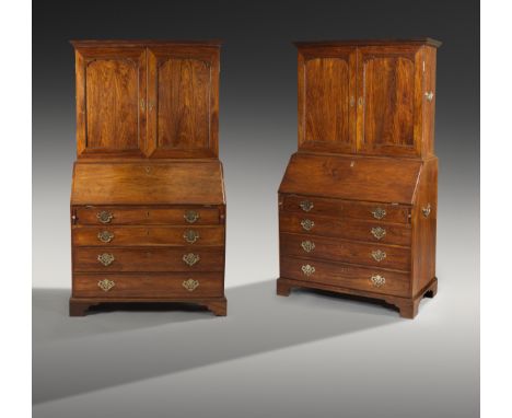A near pair of 18th century Anglo-Chinese huanghuali and padouk bureau cabinets, each with a moulded cornice above a pair of 
