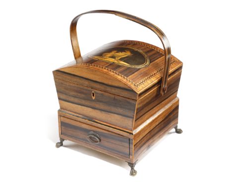 A Regency calamander sewing box, with a swing handle, the domed hinged lid inset with a print of a mother and daughter, revea