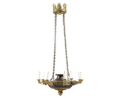 A French Restauration gilt and patinated bronze eight-light chandelier, the corona decorated with palmettes above a laurel le