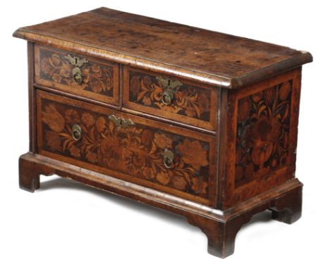 A small Anglo-Dutch walnut and fruitwood marquetry chest,  inlaid with ribbon tied flowers and the sides with urns of flowers