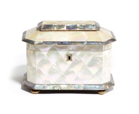 λ An early Victorian mother of pearl tea caddy, of pagoda shape and with abalone banding, the hinged lid revealing twin lidde