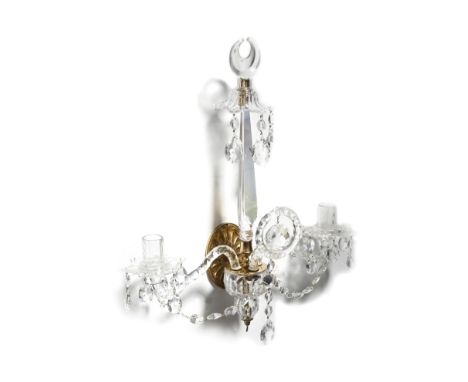 A cut-glass and gilt brass twin-light wall sconce in George III style attributed to Wilkinson's, the oval fan patera backplat