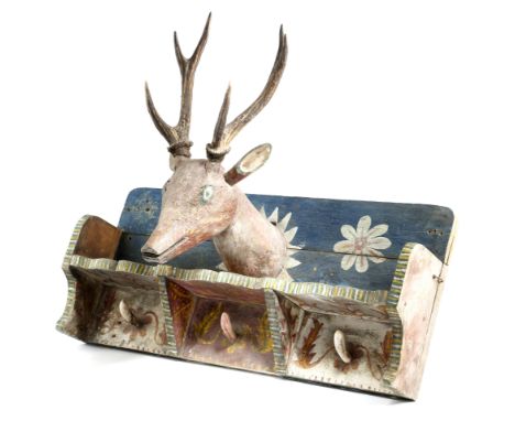 A Norwegian folk art painted pine wall hanging coat rack, decorated with leaves and flowers, with a central stag's head with 