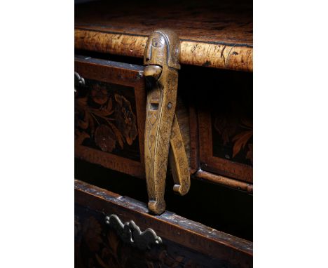 A primitive treen lever-action figural nutcracker, probably walnut, in the form of a man wearing a helmet or with stylised ha