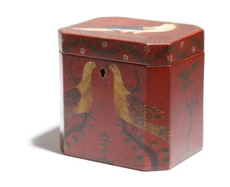 A folk art painted tea caddy, of rectangular form, with canted corners, decorated with birds, trees and scrolling leaves and 