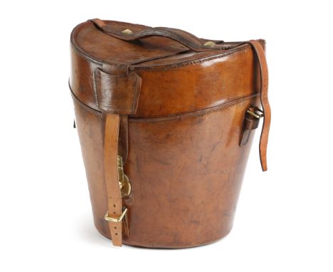 An Irish brown leather bucket shaped hat box by George Perry, for two hats, the hinged lid stamped 'GEO. PERRY &amp; CO. LTD.