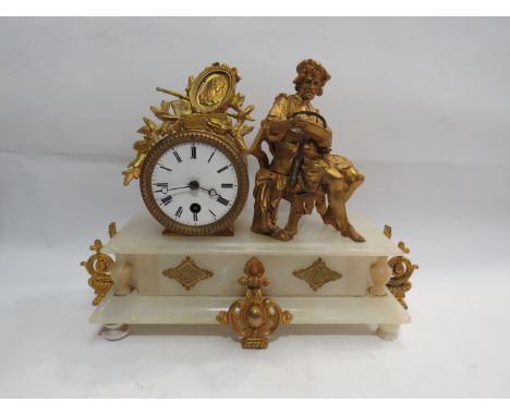 A French 19th Century marble and ormolu mantel timepiece with seated figure, possibly depicting Berhard Palissy. White enamel