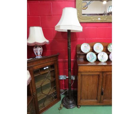A carved Oriental lamp standard with shade