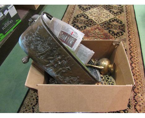 A box containing brassware including a brass planter embossed with figures, on lions feet 