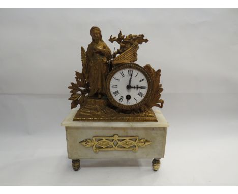 A brass and marble mantel timepiece, enamel dial with Roman numerals, circa 1880, 23cm x 33cm.  With key and pendulum 
