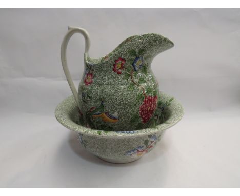 A Copeland Spode wash jug and bowl decorated with peacocks and peony flowers
