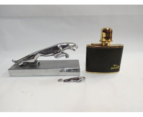 A chrome Jaguar car mascot mounted on plinth display base, a hip flask and key ring (3)