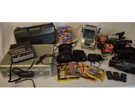 Various cameras and camcorders including JVC VHSC, Samsung Video 8, 35mm cameras including Olympus, Polaroid, Goko film viewe