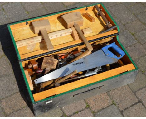 Wooden toolbox with various hand tools