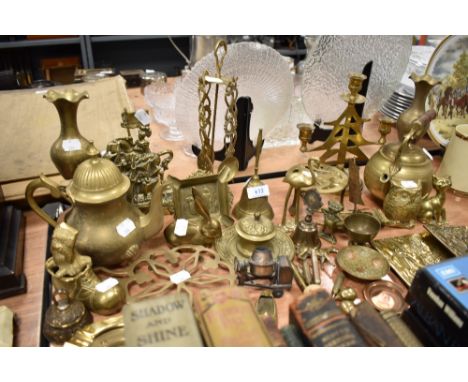 A selection of brass wares including kettles, candle stick and figures