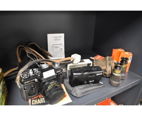 A selection of cameras including Zenit EM , Kodak instamatic 33 and Panorama