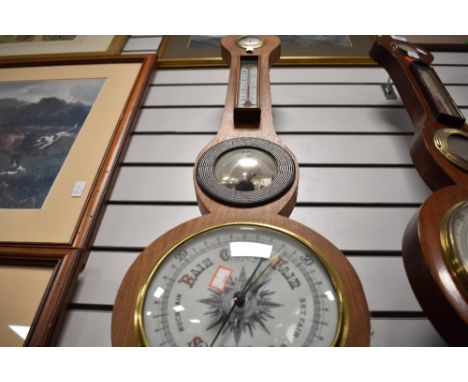 A late Victorian barometer of banjo form with enamel face dial by JJ Lockwood of Preston