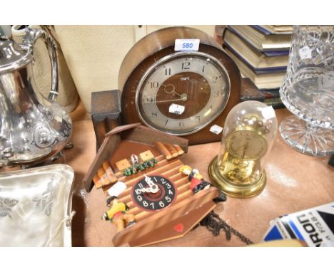 An art deco Smiths mantle clock, a Schatz anniversary clock and similar cuckoo clock