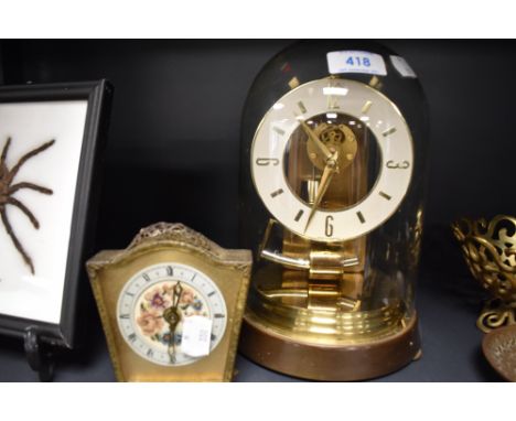 A skeleton style brass anniversary clock by Kundo and similar mantle clock