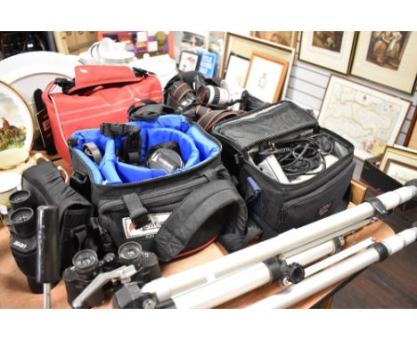 A selection of camera and photography equipment including Minolta and tripod