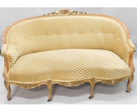 A 19thC giltwood sofa, with a padded back, armrest, and seat upholstered in gold pattern fabric, on cabriole legs with wooden