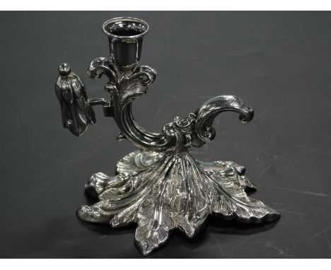 A Victorian silver chamberstick, with scroll shaped sconce and leaf cast base, Sheffield 1847 and a matching snuffer, 2½ozs