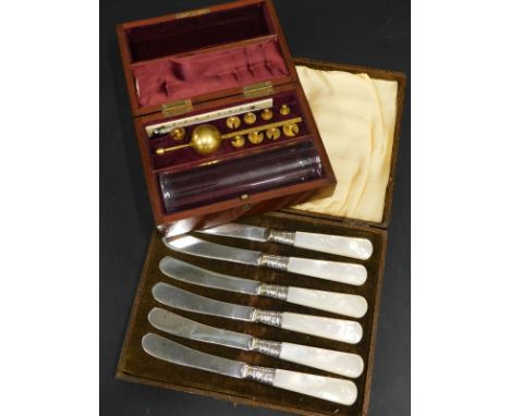 A hygrometer and glass, in fitted mahogany case and a set of silver plated and other of pearl dessert knives (2)