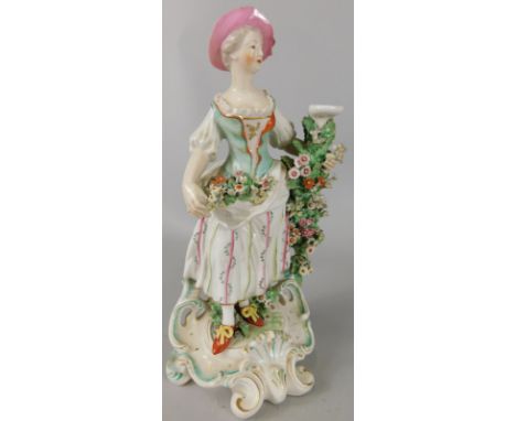 A late 18th/early 19thC Derby porcelain centrepiece base, modelled in the form of a lady carrying flowers etc., incomplete, p